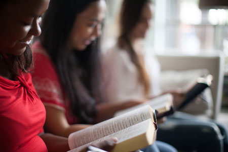 ladies in a row with Bibles