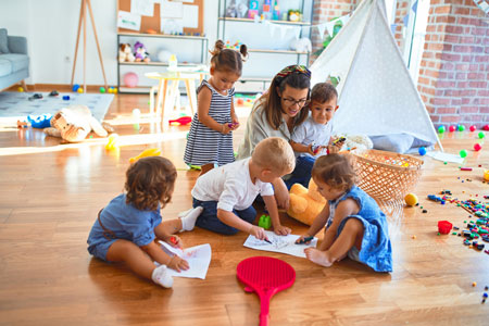 Woman teaching toddlers